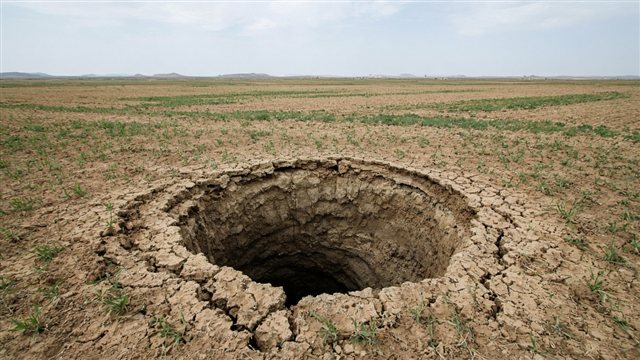Large sinkhole in dry Turkish farmland suggesting groundwater collapse