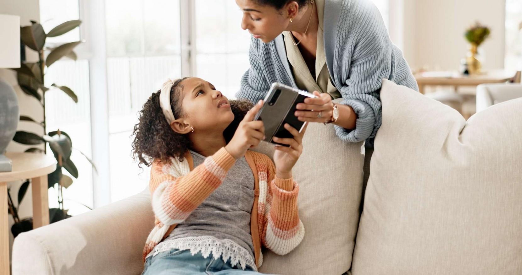 Child using a smartphone with social media apps